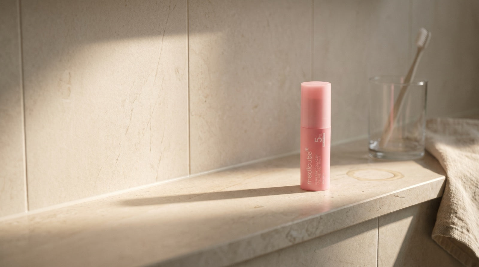 The stick on a sunlit bathroom shelf